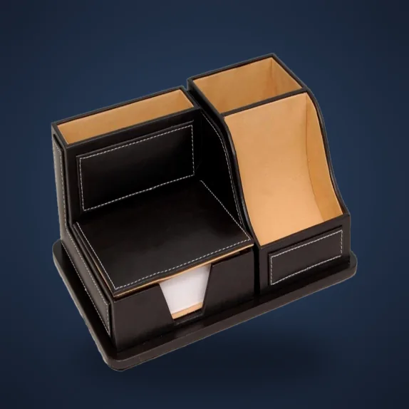 Black leatherette desk organiser with tan-lined pen and note compartments
